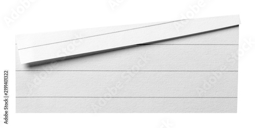 Obraz na płótnie Isolated cut out piece of blank ruled paper memo note with lines with folded cor
