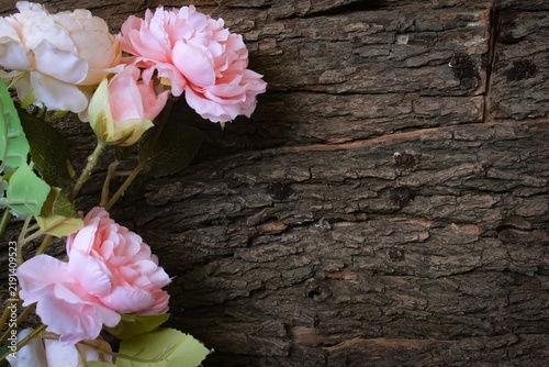Konstfotografi artificial flowers on a wooden table with copy space