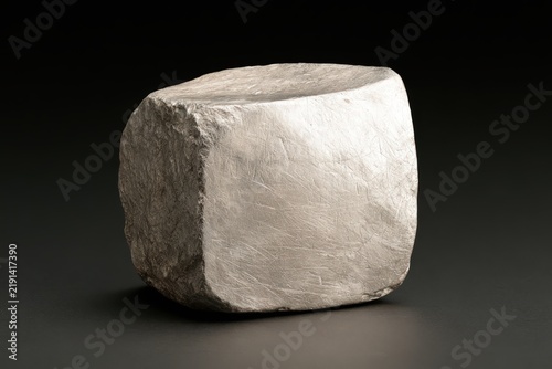 Silvery Gray Metallic Block with Matte Textured Surface