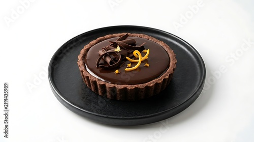 Elegant Chocolate Tart on Black Plate with Glossy Ganache and Decorative Drizzle