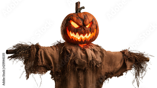 Fotografía Scary glowing jack-o-lantern pumpkin head scarecrow with tattered brown clothing