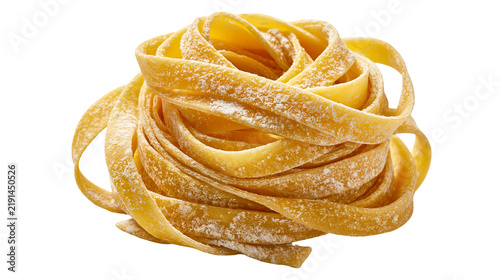 Konstfotografi Raw golden yellow tagliatelle pasta nest dusted with flour