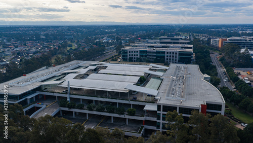 Fotografie Multilevel business park complex beside suburban arterial road, showing multilev