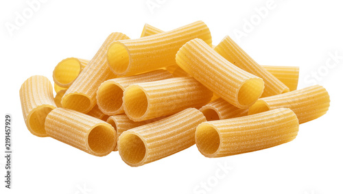 Fotografie Pile of dry rigatoni pasta tubes with ridged texture, isolated on transparent ba