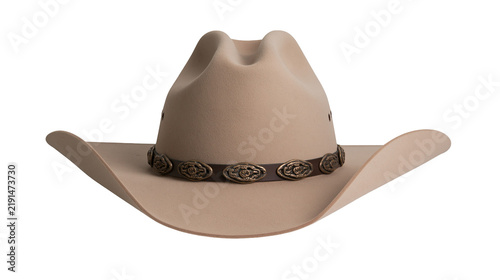 Obraz na plátně Beige felt cowboy hat with brown leather band and decorative metal conchos