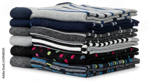 Stack of assorted colorful folded sweaters.
