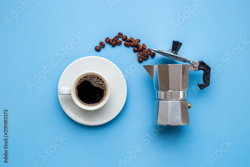 Bild auf Leinwand Fresh black coffee brewed in moka pot with coffee leaves - natural coffee experi