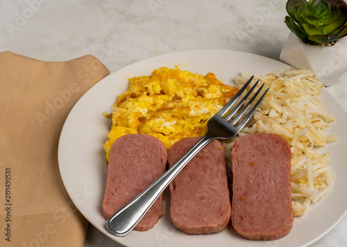 Fotografie scramble eggs  with    pan sheared spam and hash browns