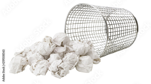 Obraz na plátně Overturned metal wire mesh wastebasket filled with crumpled white paper balls