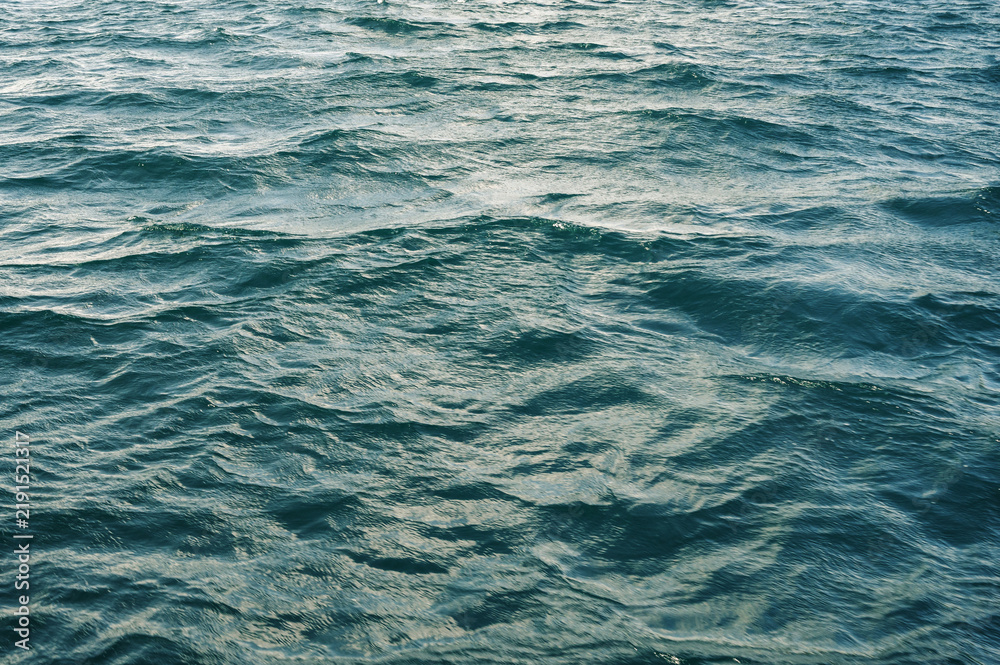 Fototapeta premium Turquoise Ocean Surface Showing Detailed Wave Patterns and Texture