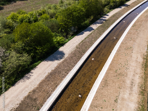 Canvas Print Drone view shows river restoration activity focused on flood protection and management in a rural area