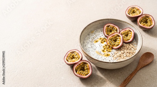 Healthy Tropical Breakfast Bowl with Passion Fruit Yogurt, Chia Seeds and Oats