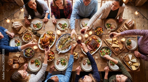 Traditional Thanksgiving holiday dinner celebration with friends and family sharing a roasted turkey feast