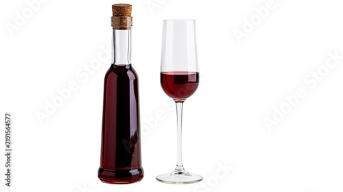 Photography Tall glass bottle with cork stopper and flute glass filled with red wine