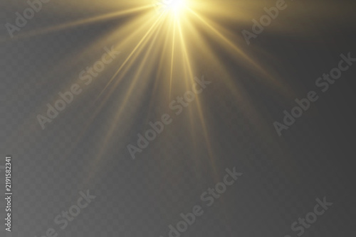 Golden light source creating sunbeam effect on transparent background
