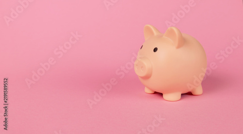 Konstfotografi Piggy bank on pink background with copy space