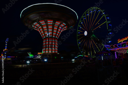 Photograph of a country fair at night