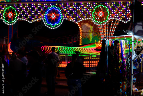 Photograph of a country fair at night
