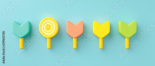 Vibrant and cheerful candy lollipops set against a blue backdrop offering delightful and playful sweets perfect for kids and anyone with a sweet tooth ideal for festive occasions and joyful gatherings