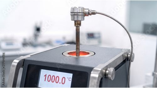 High temperature dry block calibrator with industrial RTD probe operating at 1000 degrees Celsius in precision metrology laboratory