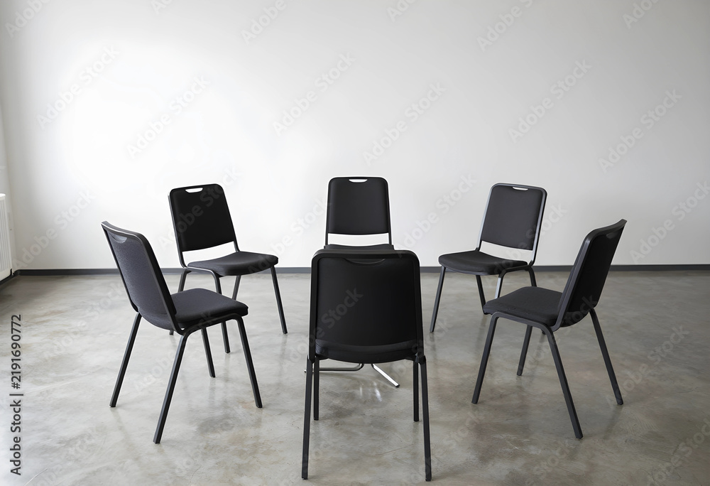 Fototapeta premium Group therapy and support circle empty chairs arranged in a ring for team collaboration communication and mental health discussion in a modern office