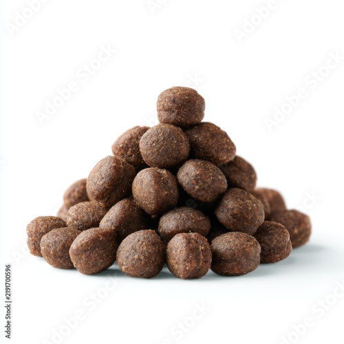 Pile of Dry Pet Food Kibble on a White Background for Animal Nutrition and Pet Care Concepts