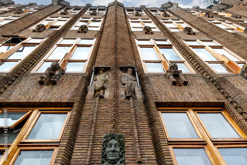 Stone sculpture of Speelman on the facade of the Scheepvaarthuis in Amsterdam, Noord-Holland, The Netherlands, Europe
