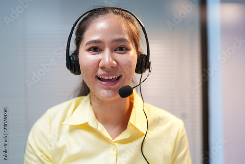 Obraz na plátně Smiling Customer Service Representative Wearing Headset