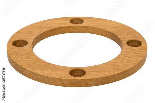Fotografie Light brown wooden ring with four circular holes is precisely cut and isolated o