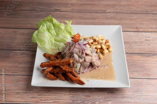 Fotografie Peruvian seabass ceviche with sweet potato and fried corn