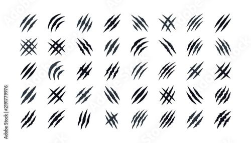 Collection of black wild animal claw scratches and monster slash marks vector illustration isolated on white background.