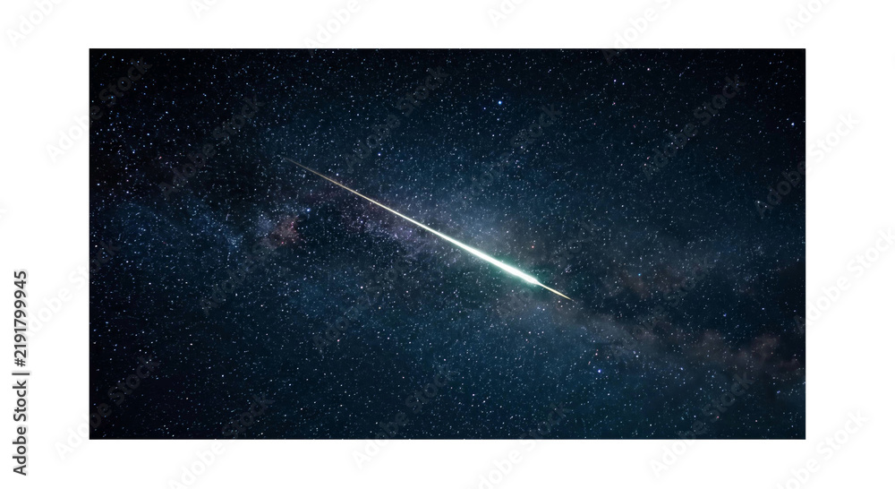 Fototapeta premium Bright meteor streaks across the starry night sky and Milky Way galaxy