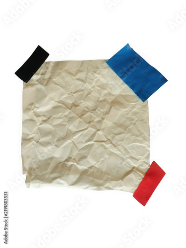 Obraz na plátně A piece of wrinkled beige paper held in place by colorful pieces of adhesive tap