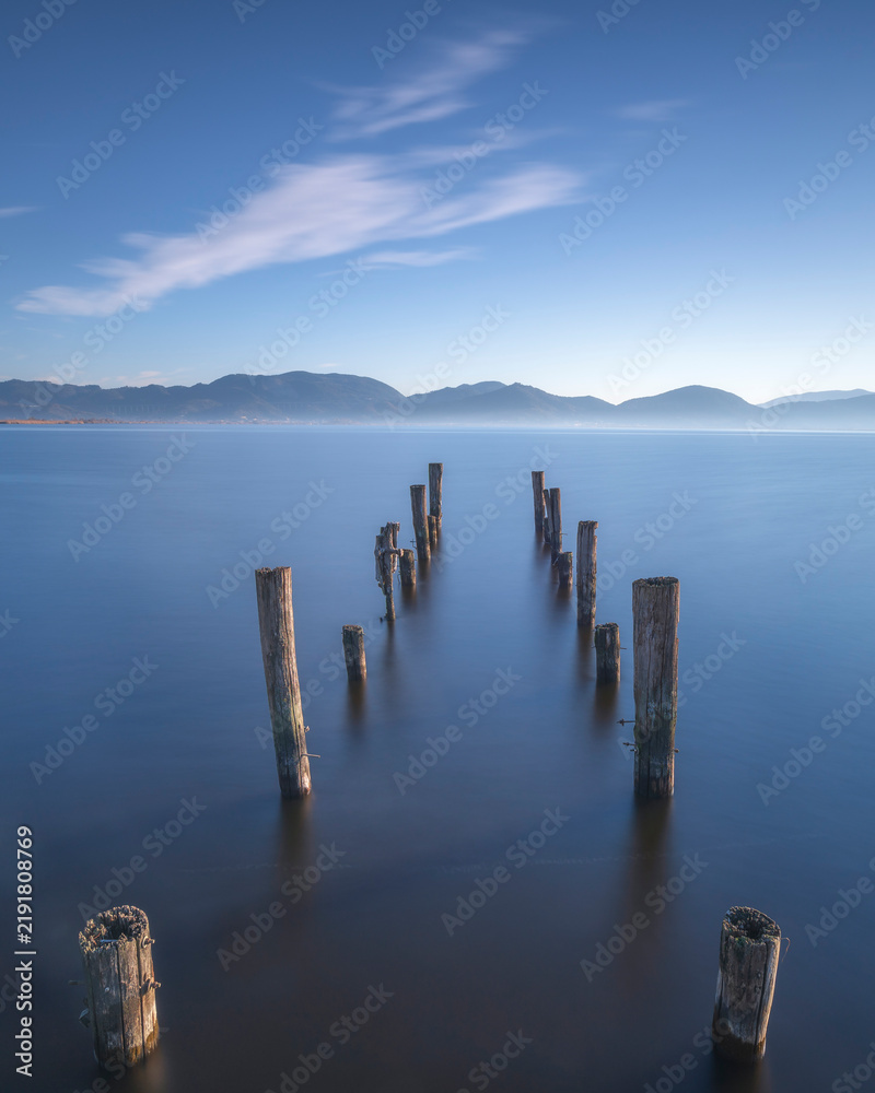 Fototapeta premium Old Wooden Pier Remains Massaciuccoli Lake Long Exposure