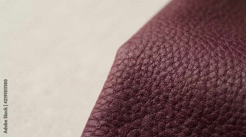 Fototapeta premium Close-up of burgundy textured fabric with raised quilted pattern