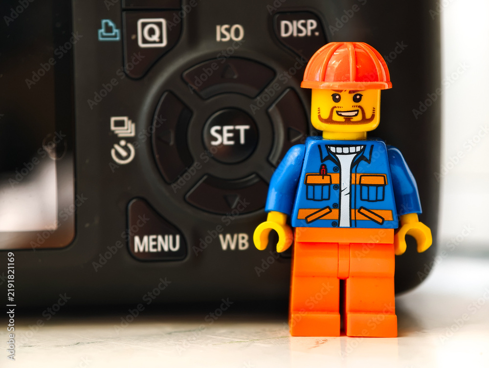 Obraz premium Russia, St. Petersburg, August 8, 2020 A lego man standing next to a camera, great for illustration or design concept