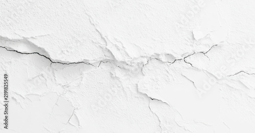 White cracked plaster wall surface texture background 