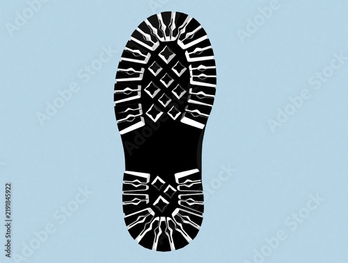 Black boot sole shows deep lugs and diamond pattern. Rugged tread offers maximum grip and traction for walking on any surface. Strong sole design for outdoor adventures.