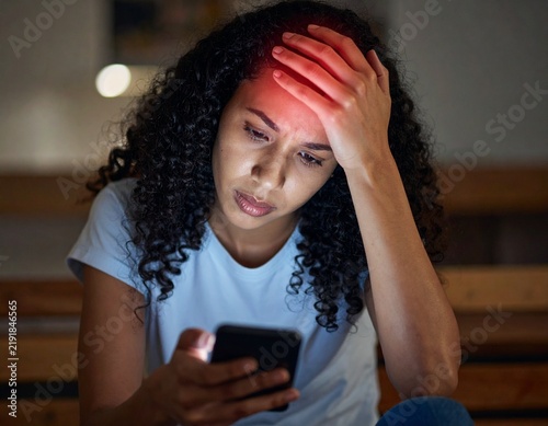 Woman touching her throbbing forehead with digital red highlight indicating acute stress and headache.