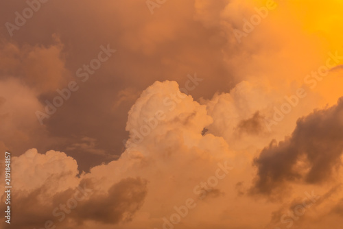 Towering cumulonimbus clouds glow with warm golden light at sunset above Kalpitiya, Sri Lanka, creating a dramatic tropical sky filled with texture and atmosphere before an approaching storm.