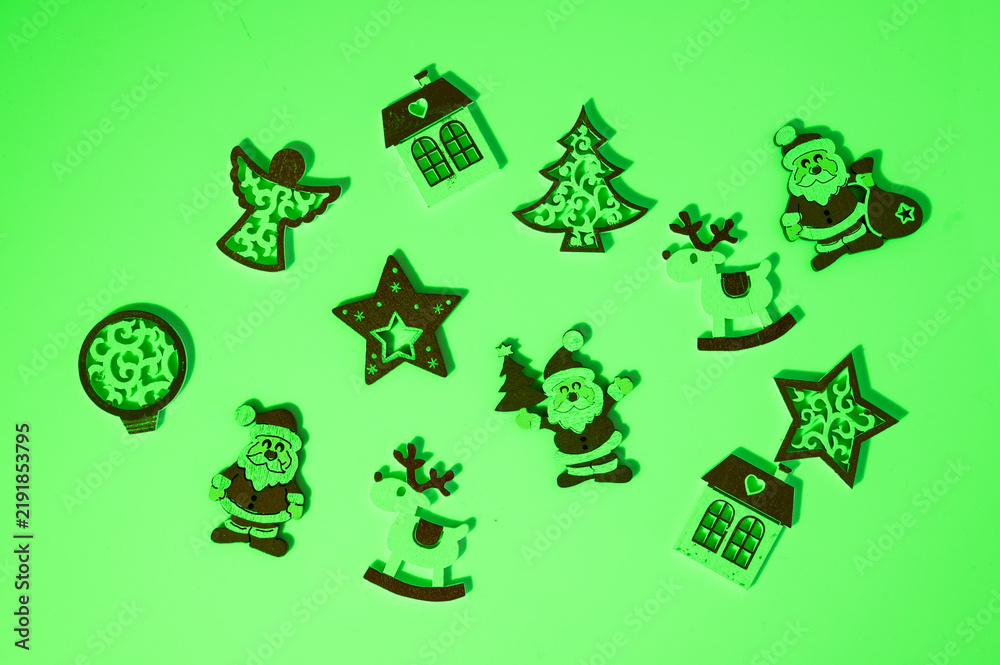 Fototapeta premium Christmas wooden ornaments creating festive green holiday display