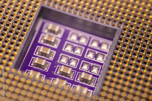 Canvas Print Close-up view of a microchip with multiple electronic components on a purple cir