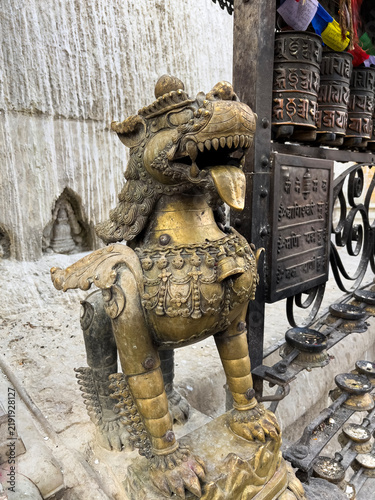 Bild auf Leinwand Ancient bronze mythical lion guardian statue at the Swayambhunath Stupa complex
