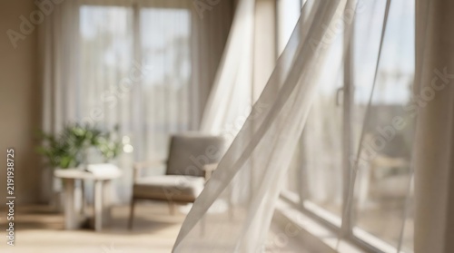 Sheer white curtains blowing in the wind near a sunny window in a modern room
