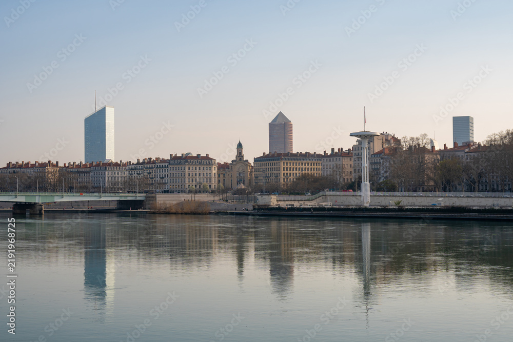 Fototapeta premium Lyon cityscape with modern skyscrapers and historic buildings reflected in the Sona river