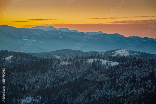 Winter sunset with a view of the Montenegrin ridge of the Ukrainian Carpathians