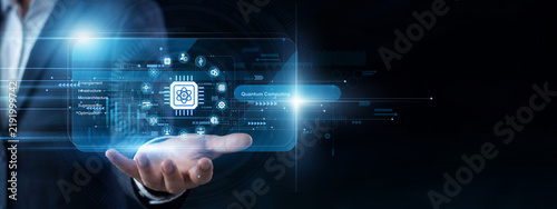 фотографія Lab scientist uses a handheld pad to operate a virtual screen programming Quantum Computing systems