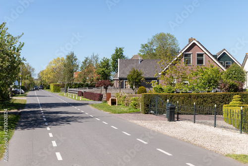 Quiet Village Street with Traditional Dutch Houses in Middelie in North Holland.