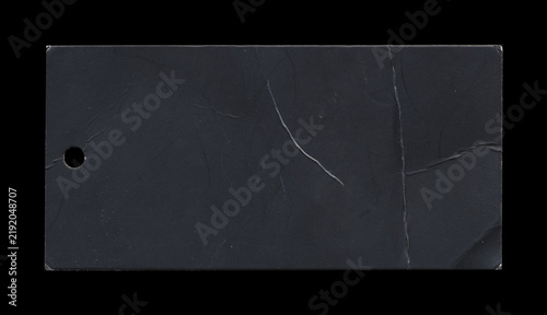 Dark navy rectangular paper tag with punched hole and surface creases