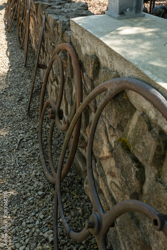 фотографія Detail of discarded metal well rings lying outdoors.